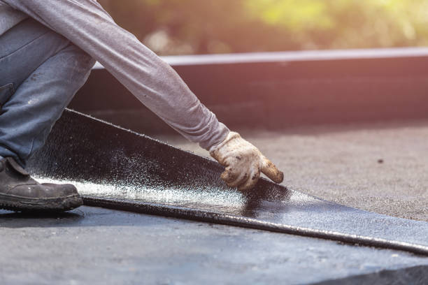 Professional Basement Waterproofing technician working in Hood, VA